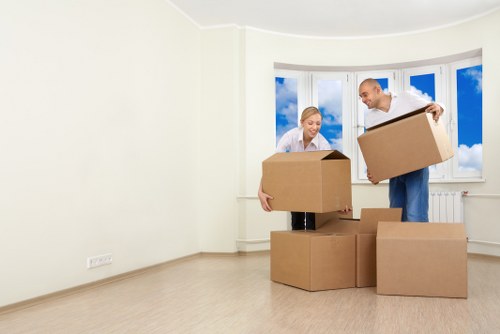 Packed boxes and furniture prepared for a Mile End house move