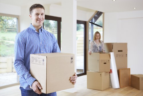 Moving boxes and furniture in a Mileend apartment