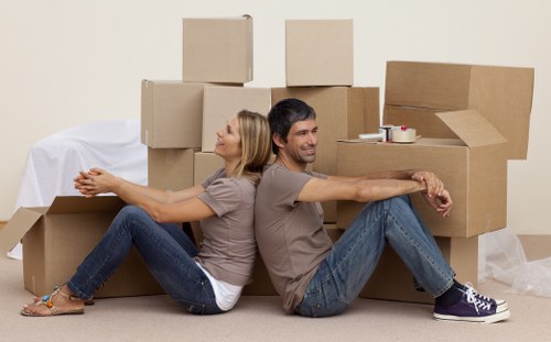 Careful loading of furniture and boxes for a small removals job in Mileend
