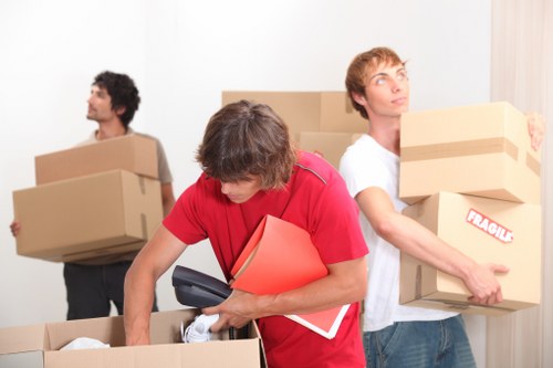 Organised moving day with furniture and boxes prepared for storage in Mileend